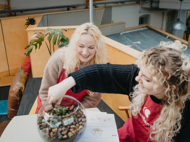 Mother and daughter making a terrarium together